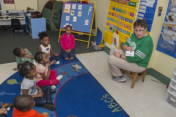 Teacher Lynda Boriska working with Pre4CLE students at St. Augustine Child Enrichment Center