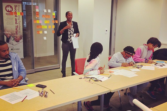 Graphic designer Arlene Watson leads a workshop to create the MOOS visual identity