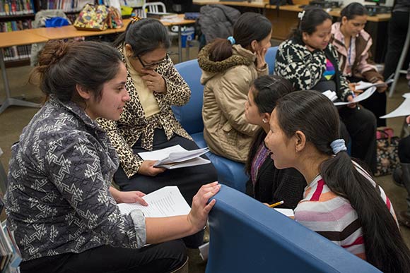 Alyssa Golinar, Community Outreach and International Services Coordinator at Global Cleveland helping Nepali refugees practice English