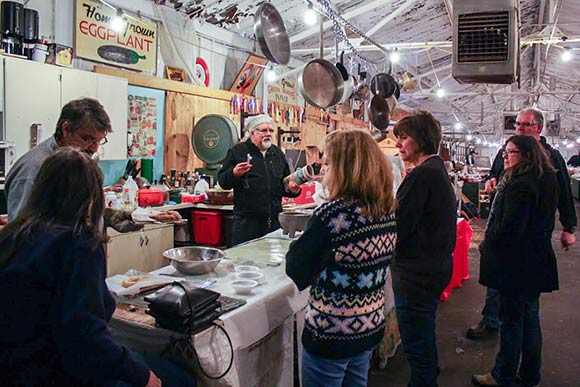 A group gathers at Coit Road Farmers Market to learn how to make Bavarian pretzels