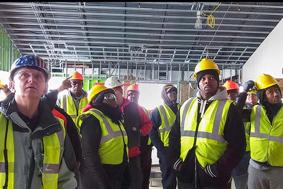 PAT class on a construction site tour with Tri-C instructor Gene Stapanek