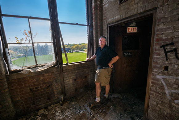 <span class="content-image-text">Developer J. Shorey inspects the interior of the Foundry Project bldg</span>