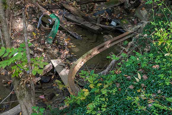 A bent rail from the old rail road is still visible