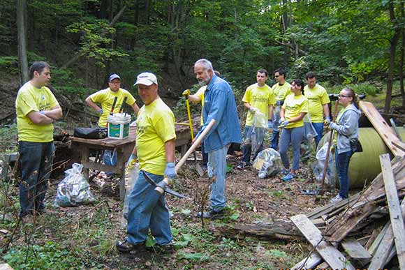 Ernst & Young volunteers gathered for a cleanup of the Euclid Railroad-Green Creek Corridor