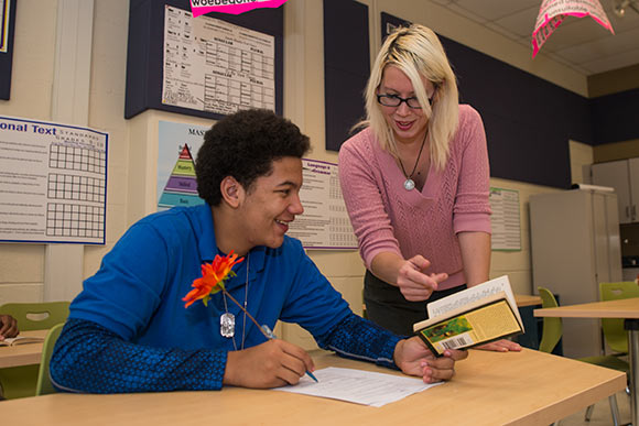 Teacher Jennifer Poland working with Marvin Watts at Cleveland High School for the Digital Arts