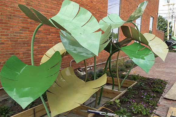 Sculpture above the cisternn where rainwater flows through the leaves and trickles down to the cistern at Mitchell's