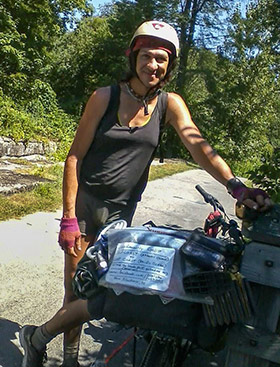 <span class="content-image-text">A woman celebrates life with a cross country cycling adventure.</span>