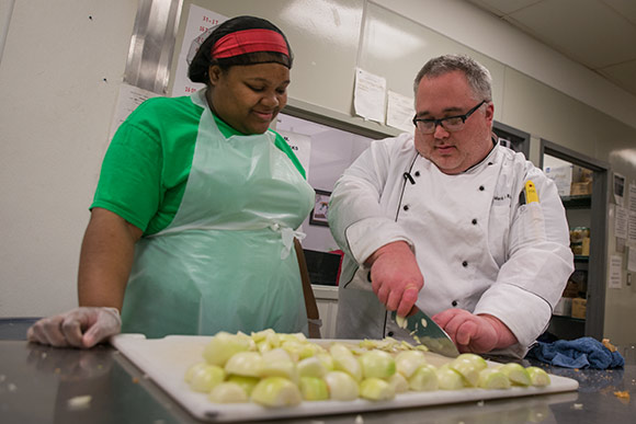 Chef Mark Ridenour working with a trainee in the Culinary Training Program at Lutheran Metropolitan Ministries