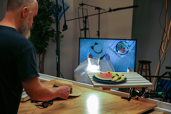 Filmmaker Michael Scott Manne setting up a scene on the set of a commercial