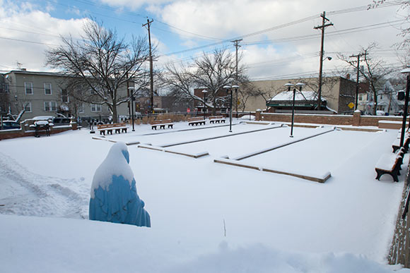 Snow covered bocce courts at Alta House