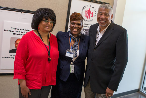 Tomeka Ewing (center) with case worker Barb Wilson (left) and LMM Executive Director Charles See