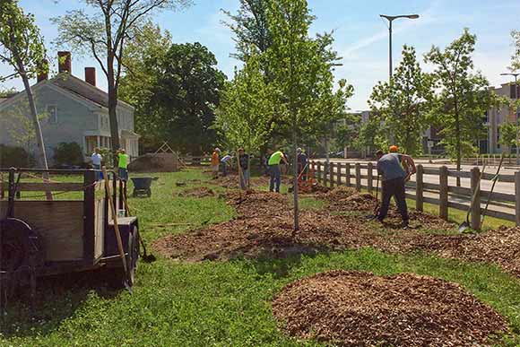 Volunteers from Fairmount Santrol helped plant trees at the Dunham Tavern site last May in Cleveland as part of a beautification effort