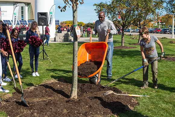 Former Cavs player Campy Russell helps out with the Trees for Threes program recently at the Great Lakes Science Center
