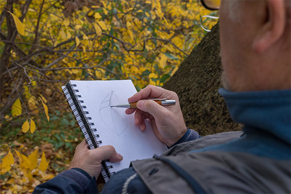 Douglas Paige making a sketch in his field notebook