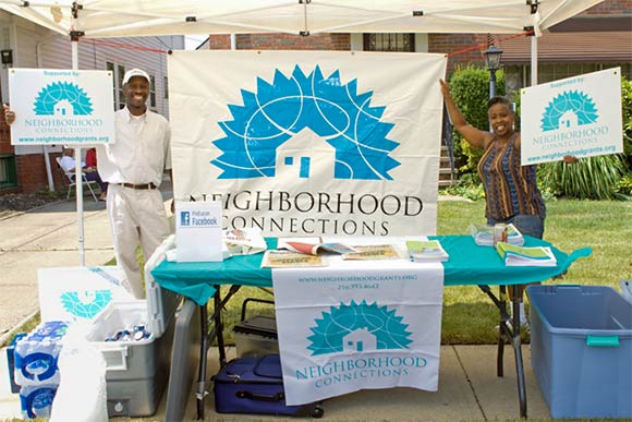 Todd Kennedy, a member of the Grant Making Committee, and Cynthia Lewis, grants manager, promote Neighborhood Connections at a neighborhood festival