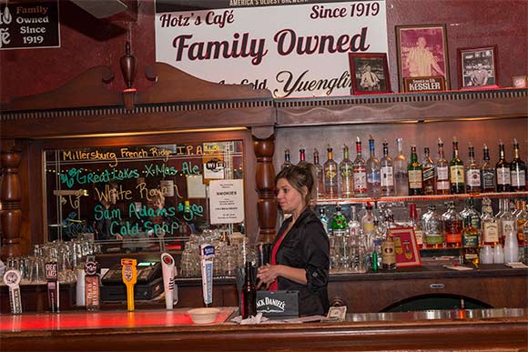 Daughter Andrea Hotz behind the bar