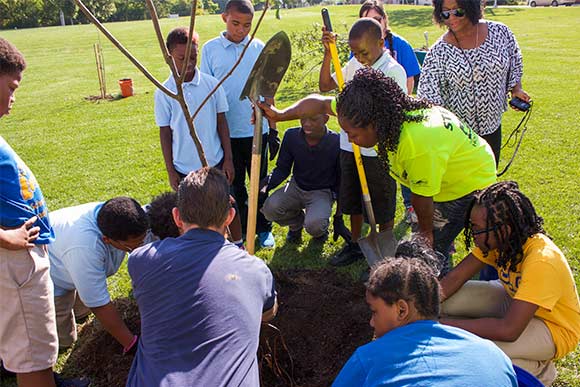 Kids from Kinsman neighborhood planting trees