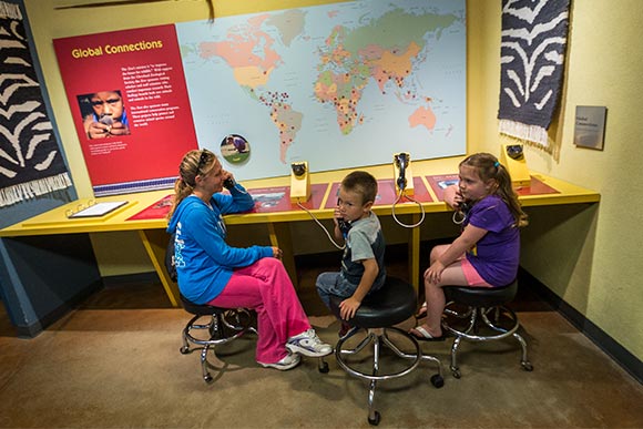 Zoo Visitors Tasha Harcourt, Aiden Harcourt and Addeline Ellis using one of the displays at the SAS Center