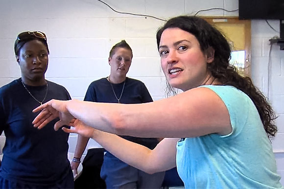 <span class="content-image-text">Lara Mielcarek directing inmates at Cleveland's Northeast Reintegration Center</span>