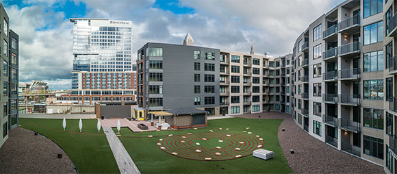 <span class="content-image-text">The Flats at East Bank Apts., Ernst & Young Tower and Aloft Hotel in the background</span>