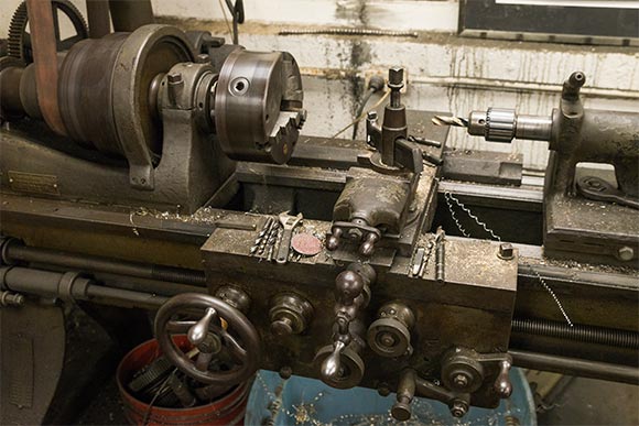 Alex uses equiptment from the 1900's to hand tool some of his parts