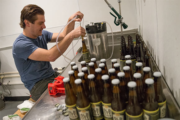 <span class="content-image-text">Mike Gulley back in 2014 filling bottles of Old City Soda</span>