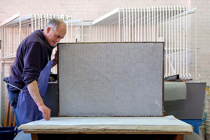 Morgan Conservatory Founder & Artistic Director Tom Balbo couches a large sheet of abaca