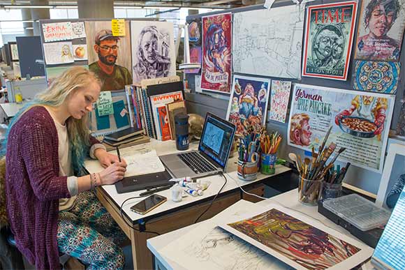 Sophomore Illustration major Erika Grauzinis working on a sketch at her workplace at CIA