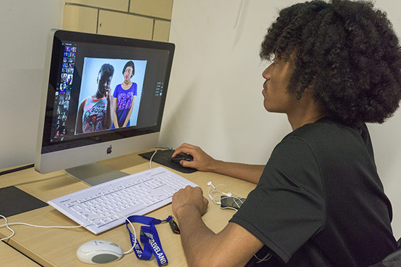 <span class="content-image-text">Photography student in the NewBridge after School program</span>