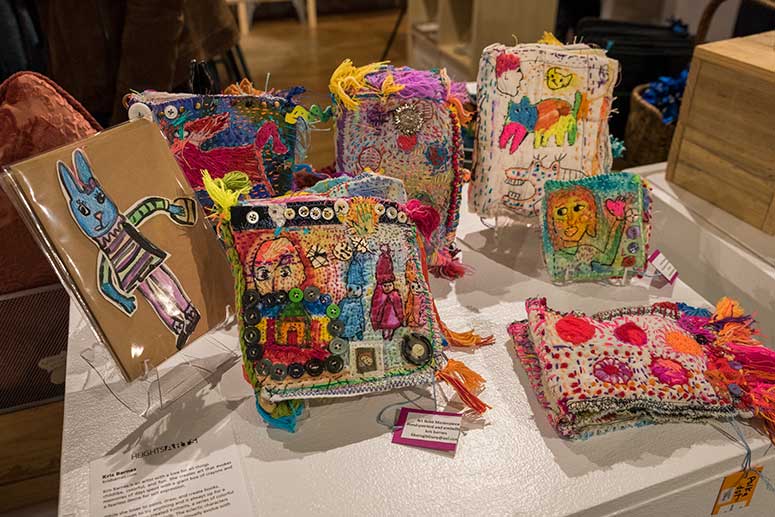 Colorful knit and felted fine art dolls by artist Kris Barnes at Heights Arts