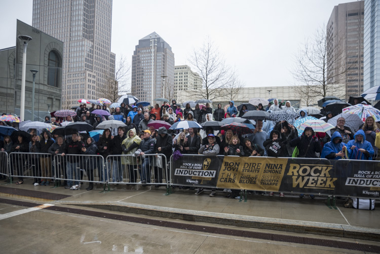 <span class="content-image-text">Fans waiting in the rain behind the red carpet to watch the inductees and other celebrities roll in</span>