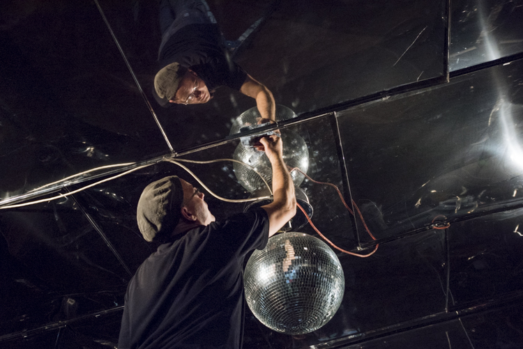 Artist Doug Meyer polishing up his mirrored room