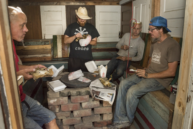 Artist and curator Dana Depew and his crew take a lunch break in the sauna room built for RTL