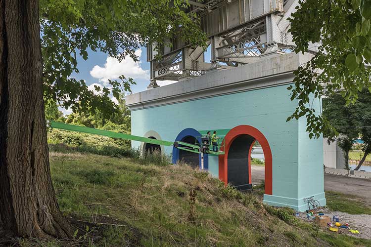 LAND studio sponsored mural by Agnes Studio - Inter| urban project on the RTA railroad bridge abutment