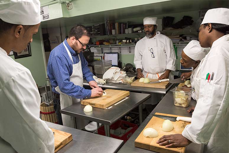 <span class="content-image-text">Learning culinary skills at Edwins</span>