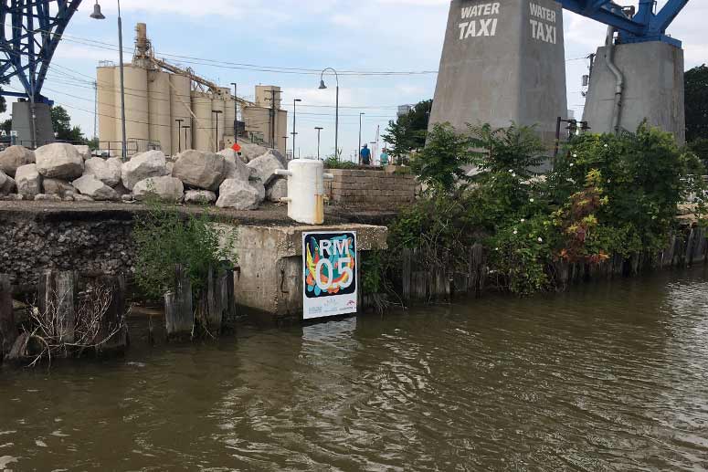 Mile marker signs along the shipping channel of the Cuyahoga