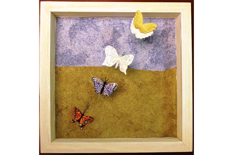 Butterfly shadowbox made by a woman who was the primary caregiver for her mother