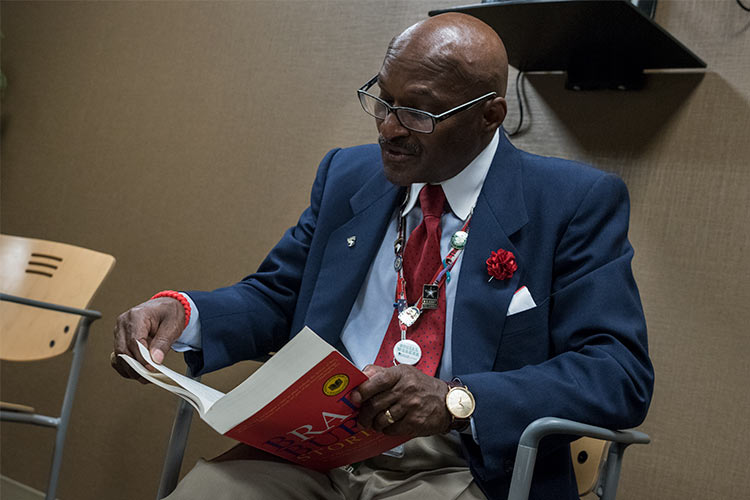 <span class="content-image-text">Walter Byers, MSW, LSC, a social worker for the US Department of Veterans Affairs reads at a recent Books@Work session at the VA Domiciliary</span>