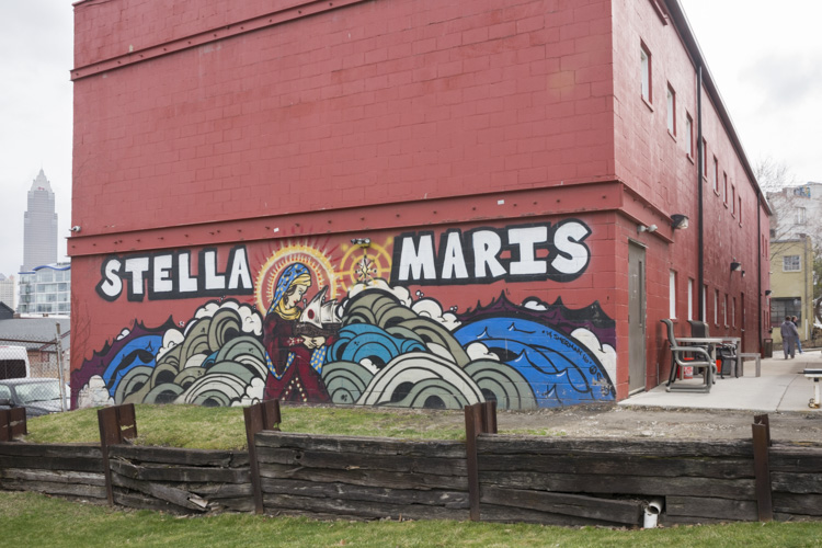 Mural by artist Kali Gibbons on the back of the supportive housing bat the Stella Maris Campus
