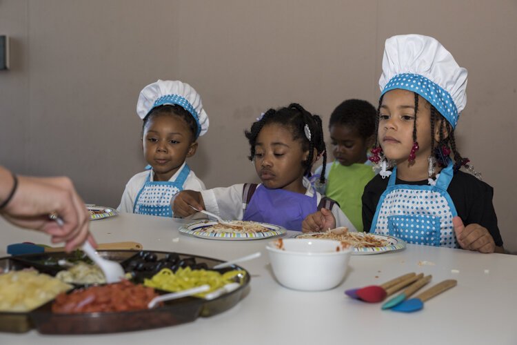 Pupils sample their study materials during a Kids in the Kitchen session.