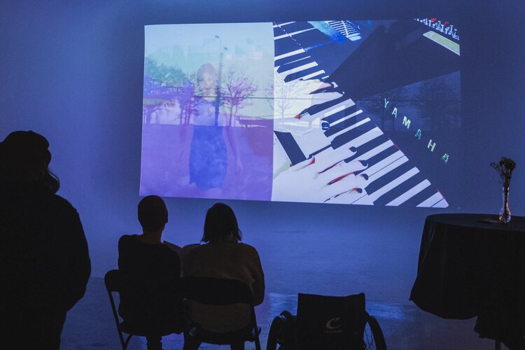 Fp Creative's guests enjoy a video installation by Natalie Braginsky.