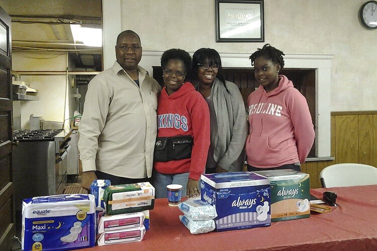 Delesia Robinson, second from left, set up her nonprofit in 2013, Pride Among Daughters and Sisters, to provide feminine hygiene products for women and girls.