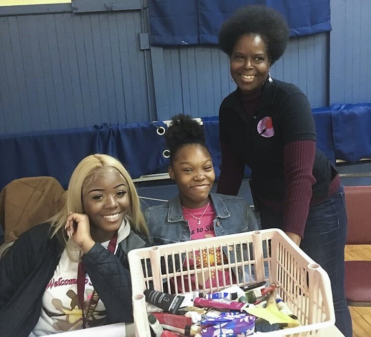 <span class="content-image-text">Delesia Robinson, far right, set up her nonprofit in 2013, Pride Among Daughters and Sisters to provide feminine hygiene products for women and girls</span>