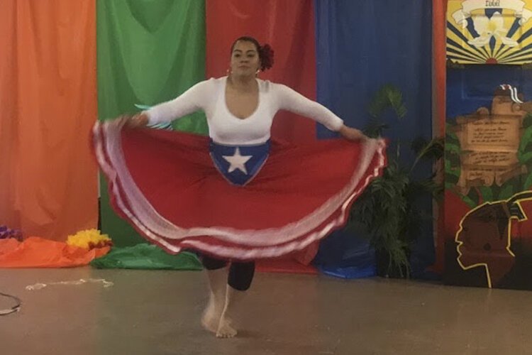 <span class="content-image-text">Bianca Sorace performs a salsa dance at Hasani Management.</span>