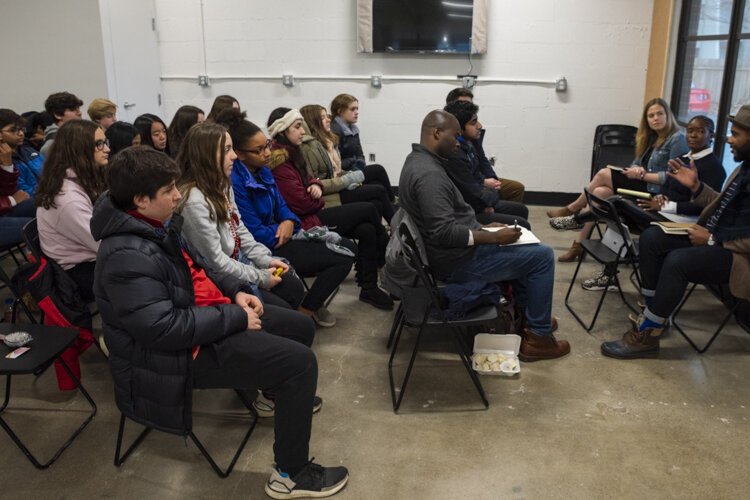 ThirdSpace Action Lab's partners talk with students from Hawken School about solving business challenges.