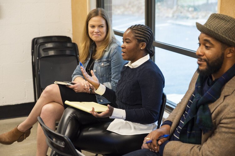 Evelyn Burnett of ThirdSpace Action Lab talks with students from Hawken School about solving business challenges.