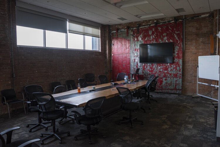 Krueger and his team decided to renovate offices that were very antiquated with drop ceilings and tiles into a more inviting space that honored the building’s rich history.