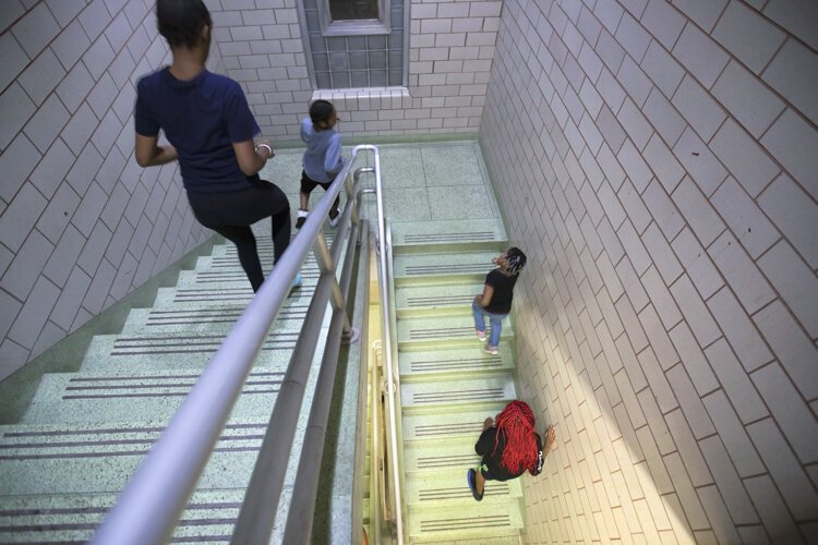 Boxers warm up before each practice by running the three flights of stairs at Fairfax Recreation Center 20 times.