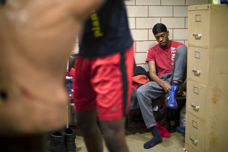 Barrick "B-Rock" Wilson, Coach Fred's 16-year-old son, gets ready for practice.