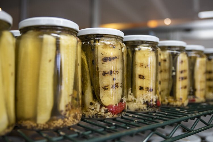 Randy’s Pickles await labeling at Central Kitchen.